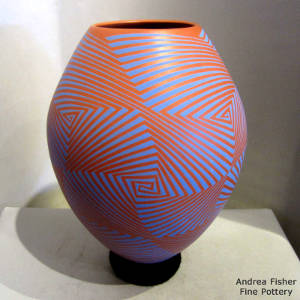 Spiral geometric design on a blue on red jar