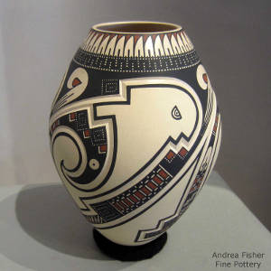 Click to see a larger version Geometric design lightly carved into and painted on a polychrome jar