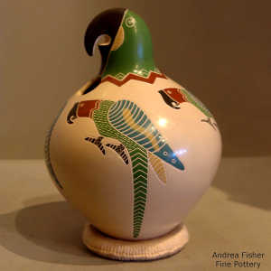 Four sgraffito and painted parrots on the body of a polychrome parrot effigy