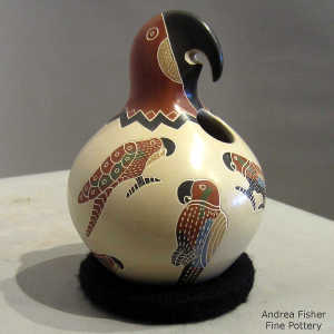 Sgraiffito and painted parrot design on a polychrome parrot effigy jar