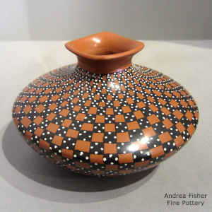 Square flared rim on a polychrome jar with a sgraffito and painted checkerboard geometric design