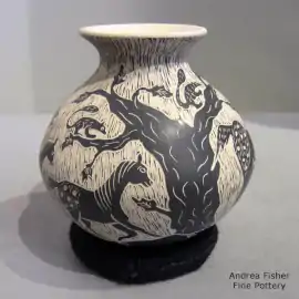 A sgraffito horse and wildlife design on a black-on-buff jar
