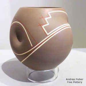 Brown jar with dimples and a polychrome geometric design