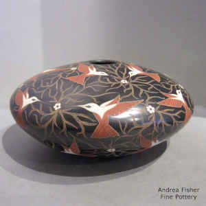 Polychrome jar with sgraffito and painted bird, branch and flower design