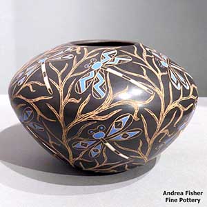 Polychrome jar with sgraffito and painted dragonfly and vine design