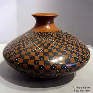 Polychrome jar with a rolled lip and a cuadrillo geometric design