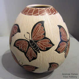 Polychrome jar with a sgraffito and painted butterfly and geometric design