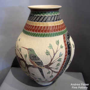 Sgraffito and painted bird, branch and geometric design on a polychrome jar