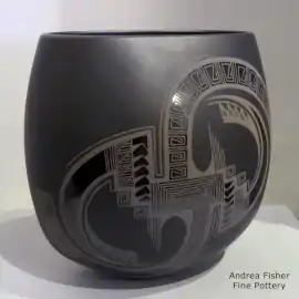 Oval black-on-black-on-black jar with a geometric design