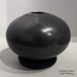 Geometric design on a black on black jar