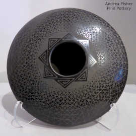 Geometric design on a low-shoulder black-on-black jar