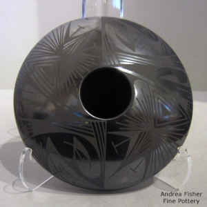 Geometric design on a black on black jar