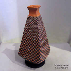 Polychrme pyramidal jar with a flared square opening and cuadrillos design