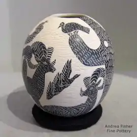 Black-on-white jar with a sgraffito wildlife and nature design