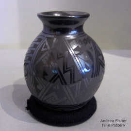 Geometric design on a black-on-black jar