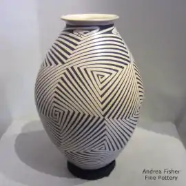 A geometric design in black on a beige vase