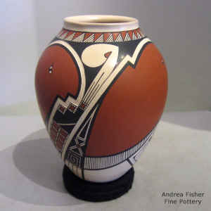 A sgraffito and painted geometric design on a polychrome vase