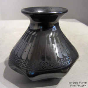 Black on black jar with a feather and geometric design