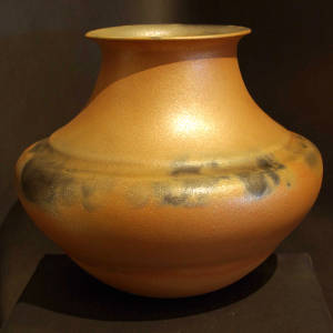 Fire clouds on a golden micaceous jar