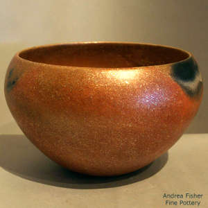 Fire clouds on a golden micaceous bowl