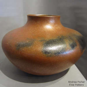Fire clouds on an orange micaceous jar