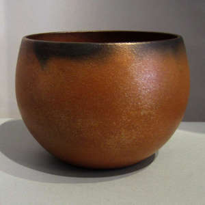 Fire clouds on a micaceous red bowl