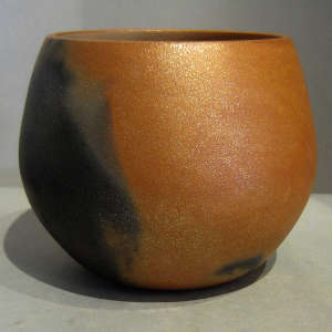 Fire clouds on a micaceous red bowl