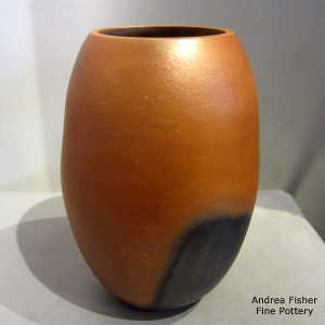 Fire clouds on a golden micaceous jar