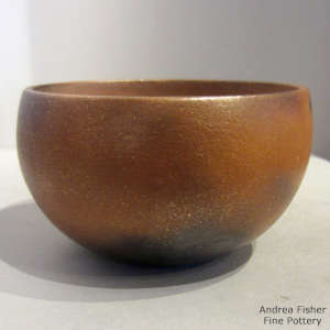 Fire clouds on a golden micaceous bowl