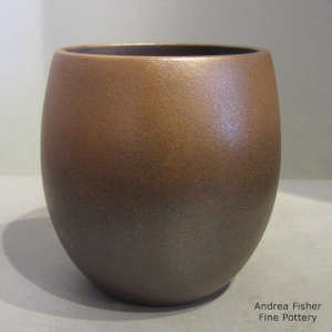 Fire clouds decorate a golden micaceous jar