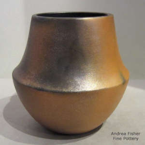 Fire clouds decorate a golden micaceous jar