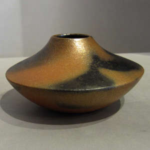 Fire clouds on a micaceous red jar