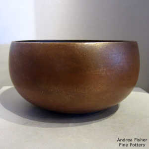 Fire clouds on a golden micaceous bowl