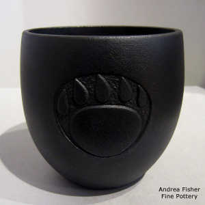 Sgraffito bear paw design on a black micaceous jar