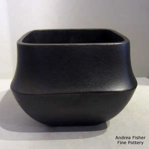Black micaceous jar in a rounded square style