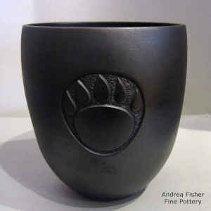 Sgraffito bear paw design on a micaceous black jar