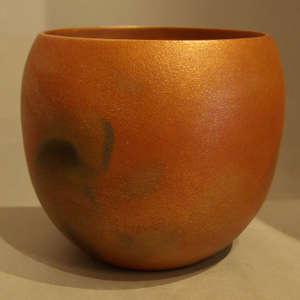 Fire clouds on an orange micaceous jar