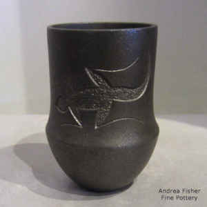 Sgraffito lizard design on a micaceous black jar