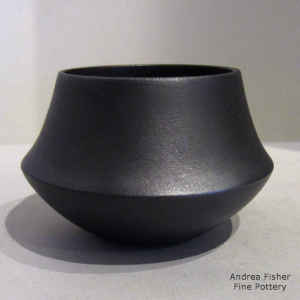 Micaceous black jar with a low shoulder