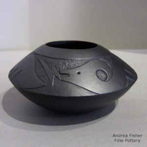 Micaceous black bowl with a sgraffito avanyu design