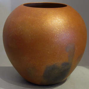 Fire clouds on an orange micaceous jar