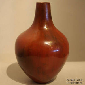 Fire clouds and pine pitch on a polished brown jar