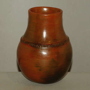 Biyo around the shoulder of a brown jar