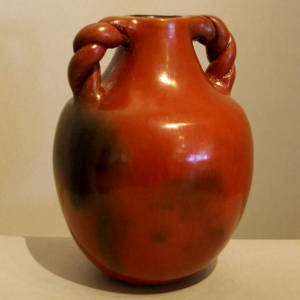 Fire clouds and braided handles on a brown jar