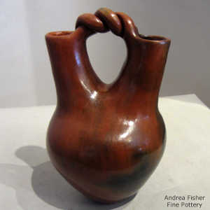 Fire clouds and braided handles on a red-brown wedding vase