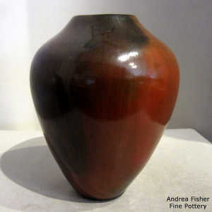 Fire clouds and pine pitch coating on a brown jar