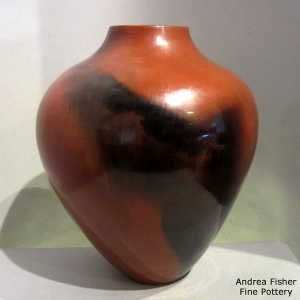 Fire clouds and pine pitch coating on a brown jar