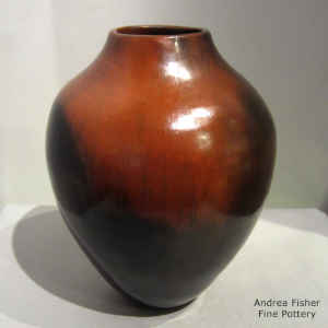 A brown vase with fire clouds