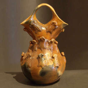 Horned toads and fire clouds on a brown wedding vase