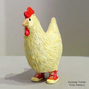 White chicken with red sneakers